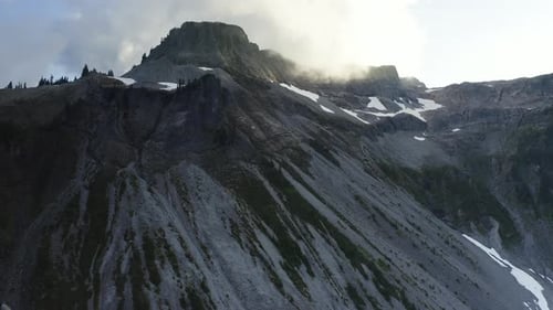 Stunning rugged cloudy forested alpine landscape of Mt Baker in Northern Cascades region of PNW