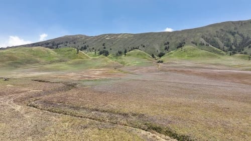 Drone Footage of the Expansive Savanna Hills at the Foot of Mount Bromo