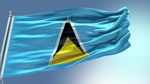Waving Saint Lucia Flag Against Blue Sky Background