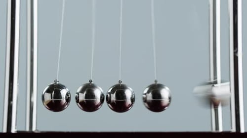 Newtons Cradle Demonstrating Momentum and Physics