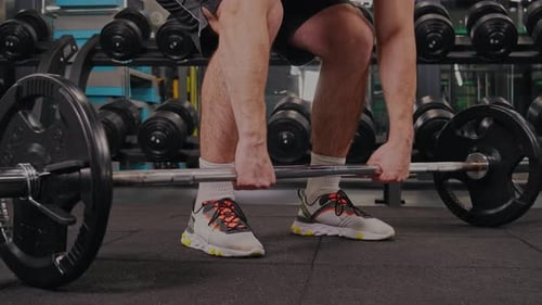 Man Doing Deadlift in Gym