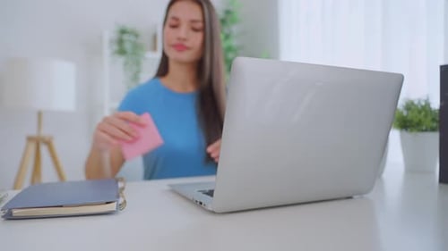 Asian woman freelancer accomplish online task and turn off the laptop.