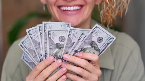 Excited Smiling Woman Showing Cash Money 1000 American Dollars Banknotes Hands with Money Close Up