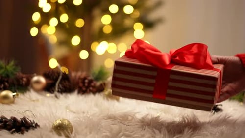 Striped Gift with a Red Bow for Christmas