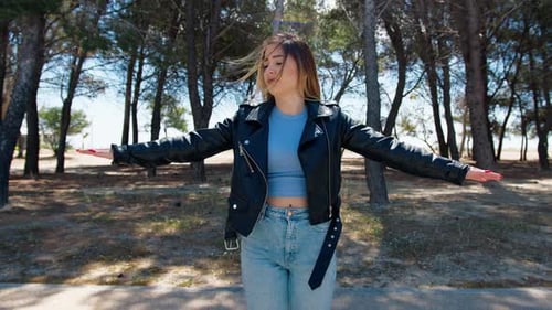 Woman Stretching Her Arms In The Park