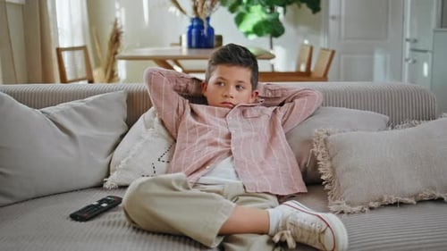 Little Boy Watching Cartoons on Tv Sitting Couch at Living Room Kid Resting