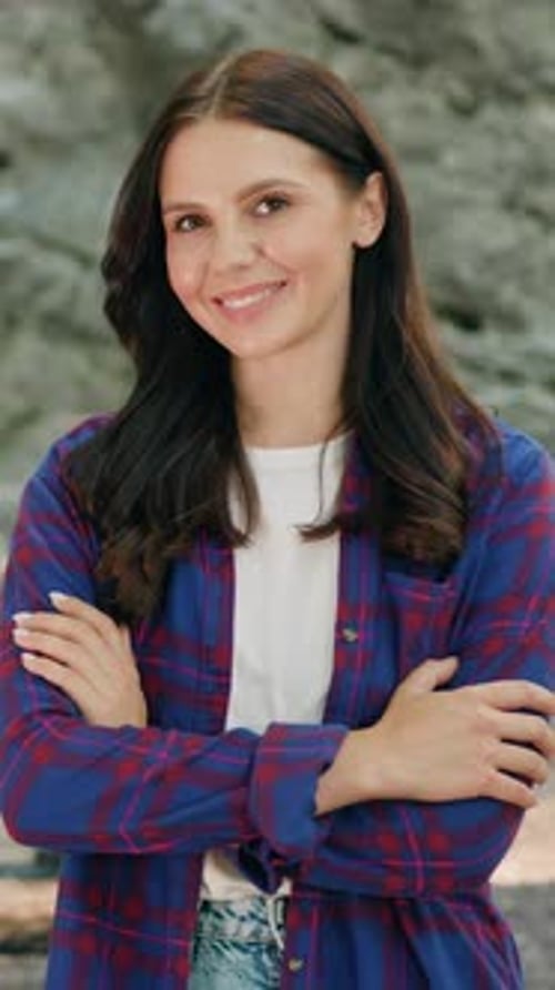 Smiling Brunette Woman in Plaid Shirt Outdoor Portrait