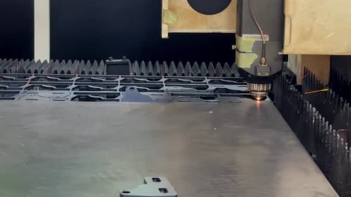 Automatic laser cutting are working to cut the metal plate