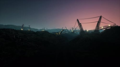 Industrial Open Pit Mine with Large Dragline Excavators and Machinery at Sunset