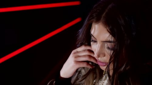 Attractive Woman Posing Sensually Under Neon Lights