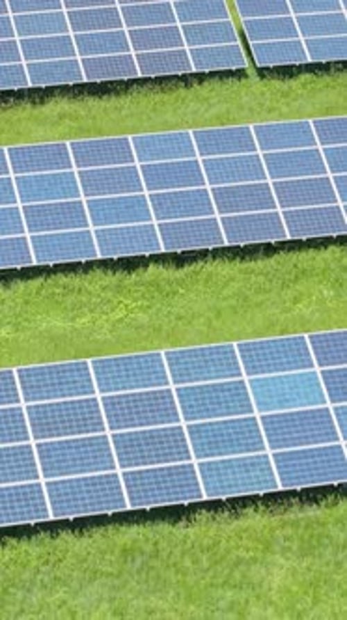 Solar Panels with Green Grass in Bulgaria Vertical Drone Perspective of Green Power and Ecological