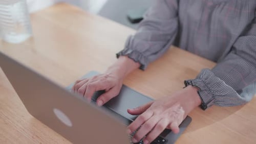 Close-up of a woman's hand using an important laptop Female hands typing on laptop computer working