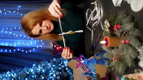 Woman Making Christmas Decorations At Home