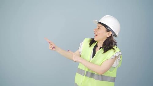 Engineer looking at camera in amazement and making a presentation.