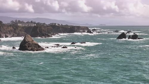 Experience the stunning California coast with this aerial left dolly shot over the ocean, showcasing