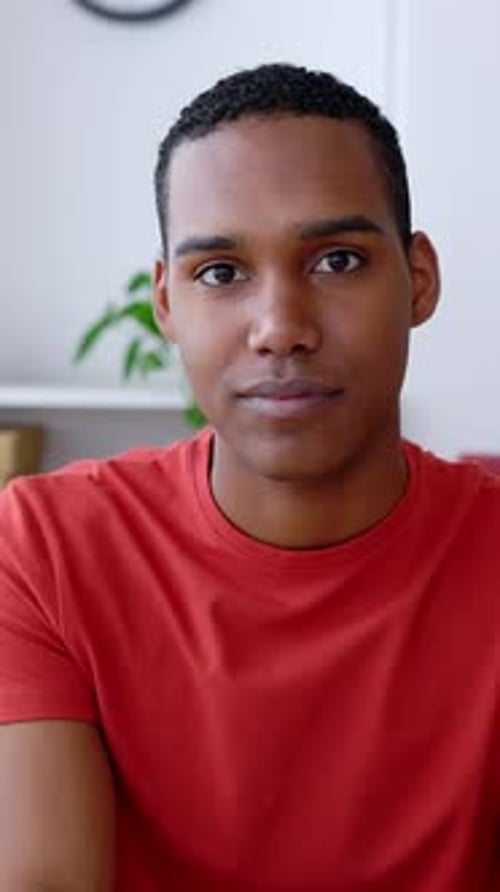 POV of Young Adult Man Listening on Laptop Video Call at Home