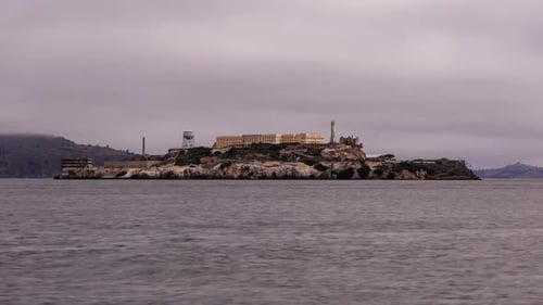 Famous landmark Alcatraz Island in the San Francisco Bay seen from San Francisco. Boats passing by,