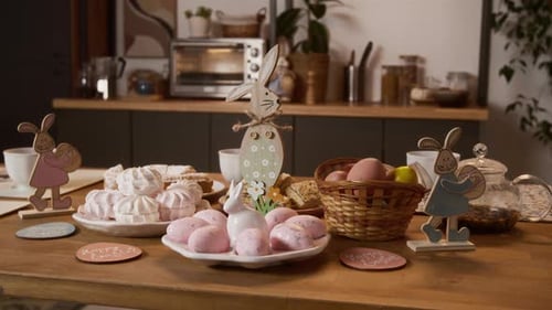 Easter treats: Marshmallows, eggs and bunny decorations on table