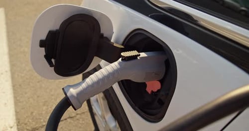 Electric Car is Connected to an Electric Filling Station