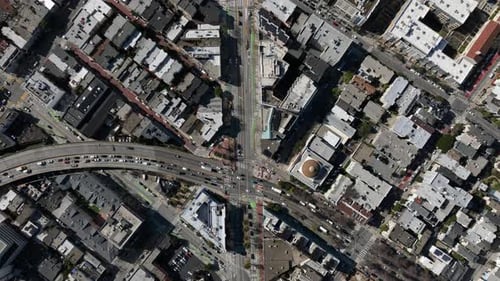 Birds Eye Shot of Traffic in Streets of Metropolis Vehicles Driving on Roads and Passing Through