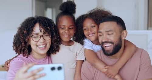 Happy Family Taking Fun Selfie Together Indoors
