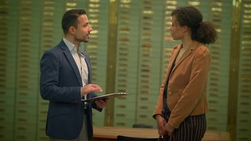 Man and Woman in Business Meeting Shaking Hands