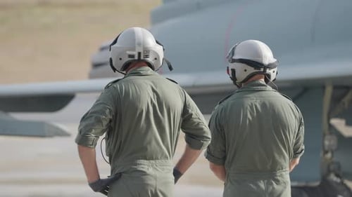 Pilots Observing Aircraft on Runway