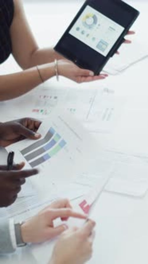 Tablet, documents and hands of business people with graphs for finance report