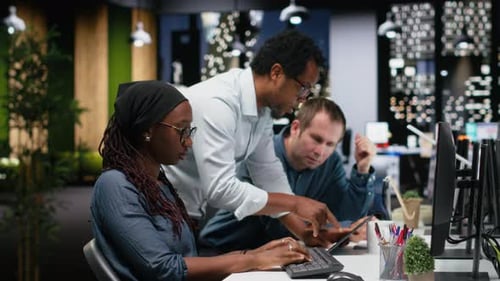 Engineering Team Brainstorming in Office Typing Code on Computer