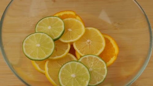 Sliced Citrus Fruits in Glass Bowl