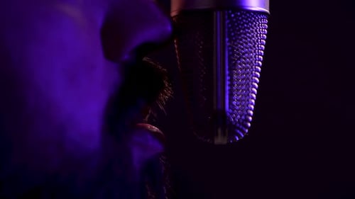 Mouth of Man With Beard Speaking in Front of Professional Microphone, Close Up