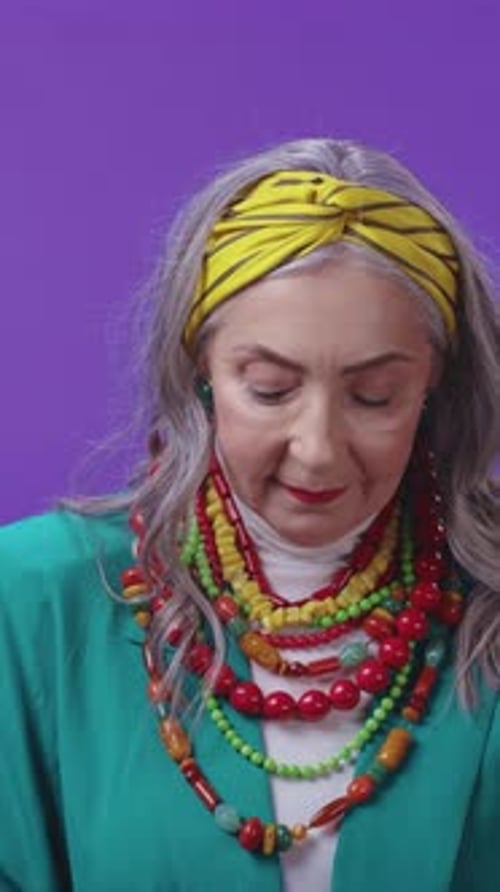 Stylish Senior Woman Wearing Vibrant Accessories Including a Colorful Headband Charming and Unique