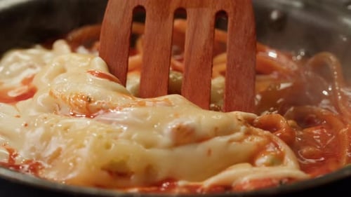 Close Up of Noodles Cooking in Pan