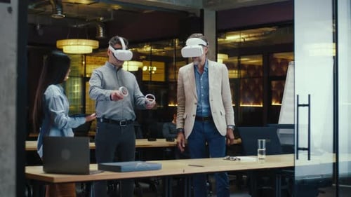 Office Workers Testing VR Headset Together