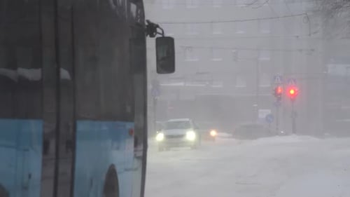 Snow Storm in City Traffic