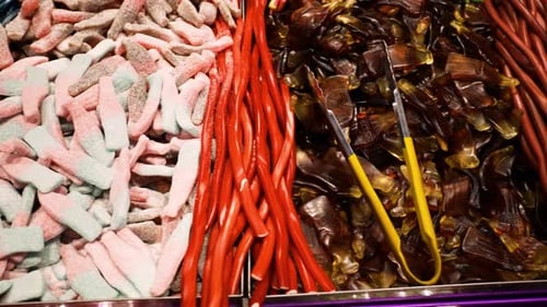 shot of a lot of colorful gummies in the candy shop