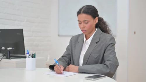 African Business Woman Writing a Business Letter