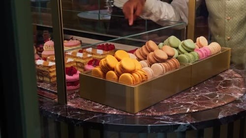 Delicious macarons and cakes displayed at bakery cafe