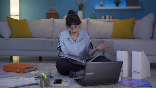 Home office worker woman looking at the file angrily.