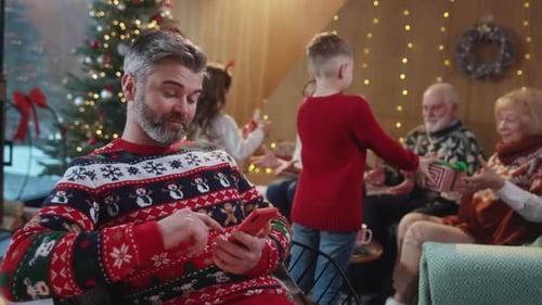 Family Gathers to Celebrate Christmas in Cozy Home