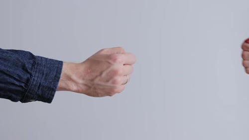 Two Hands Making Fist Bump Close Up