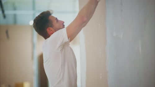 A Skilled Craftsman Perfecting Wall Finish Techniques Mastering the Art of Smooth Wall Preparation