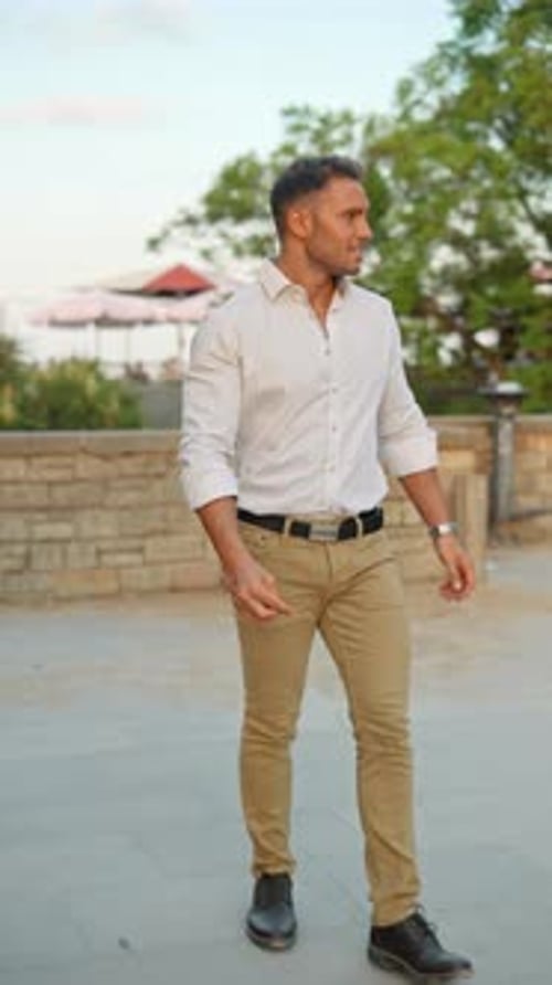 Young Adult Man Walking Towards the Camera