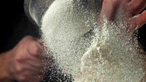 The Cook Sifts the Flour Filmed on a Highspeed Camera at 1000 Fps
