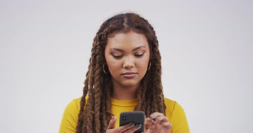Young Woman Using Mobile Phone Indoors