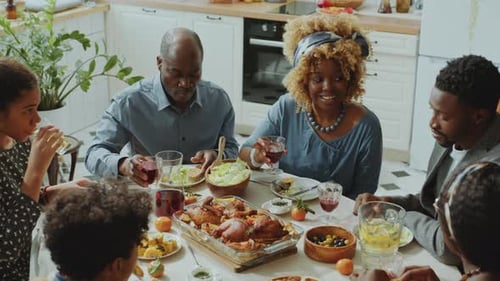 Multi-Generational Family Enjoys Meal Together at Home