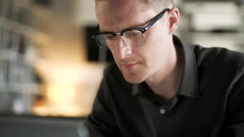 Young Man Freelancer Using Laptop Online Working From Office In Internet Smiling Focused Millennial