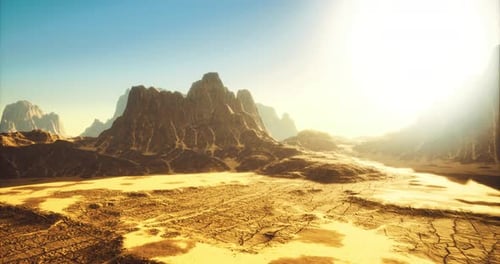Vast Desert Landscape Under Bright Sunlight with Mountain Formations in View