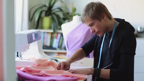 Young Blond Man Fashion Designer Working in Studio