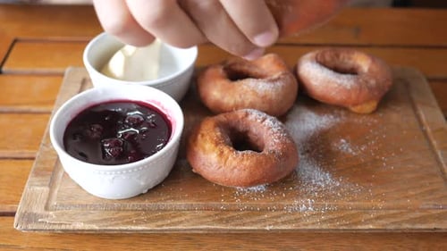 Delicious Donuts with Berry Jam and Butter